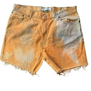 Unique Vintage Y2K Levi’s | size 38 | 559 cutoff orange dyed denim shorts